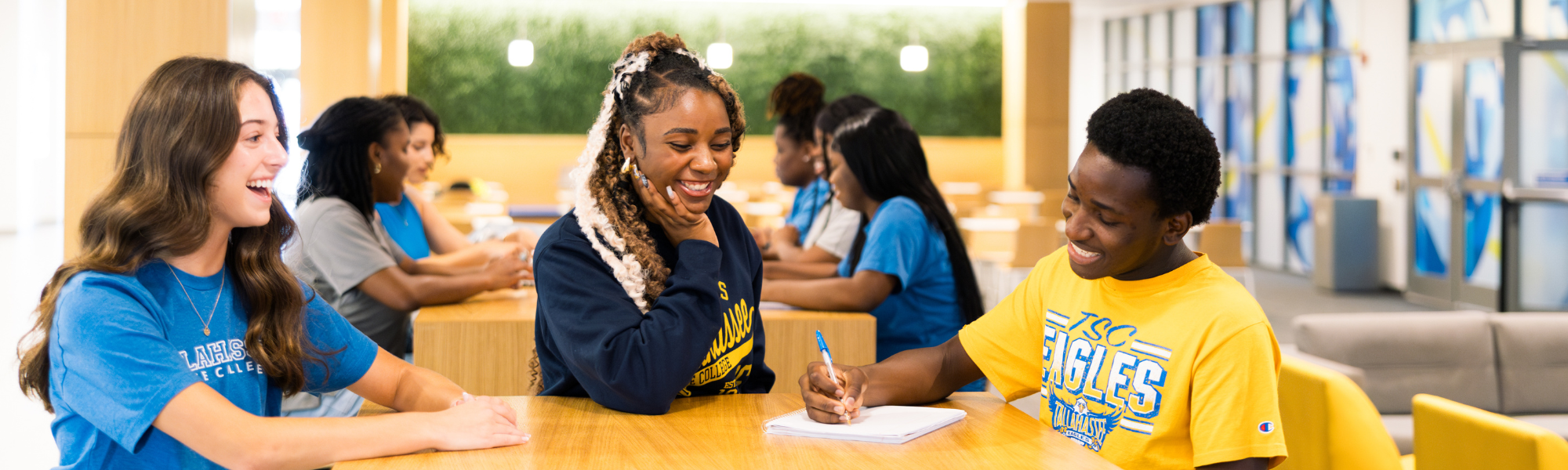 Students sitting together at Student Union high tables.